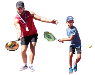 adult and child playing tennis