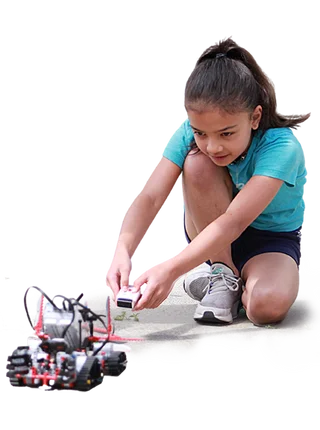girl configuring small robot car